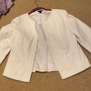 White blazer goes to about mid arm past the elbow